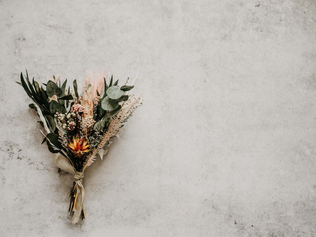 Bunch of flowers presented on a weathered white background