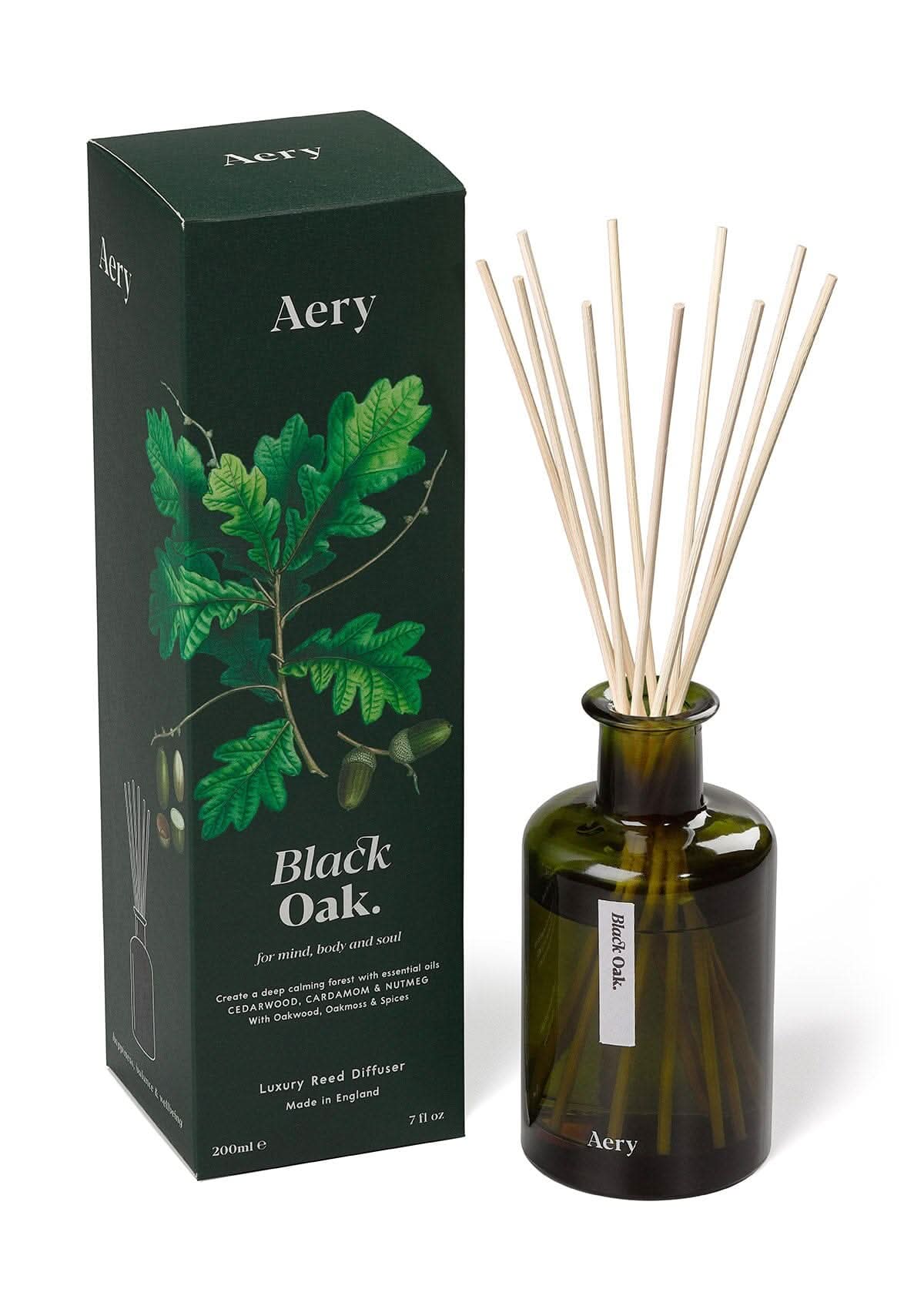 Green Black Oak diffuser displayed next to product packaging by Aery on white bacground