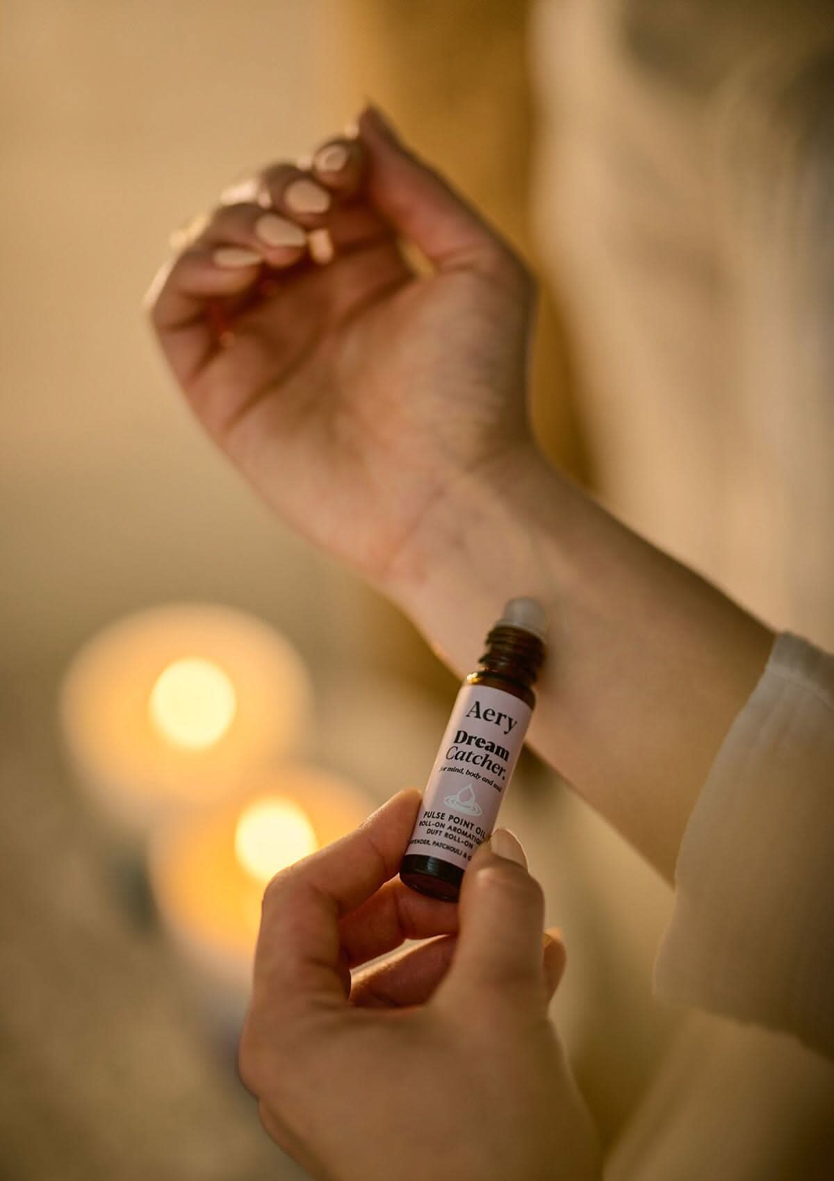 Lilac Dream Catcher pulse point oil by Aery displayed in hands