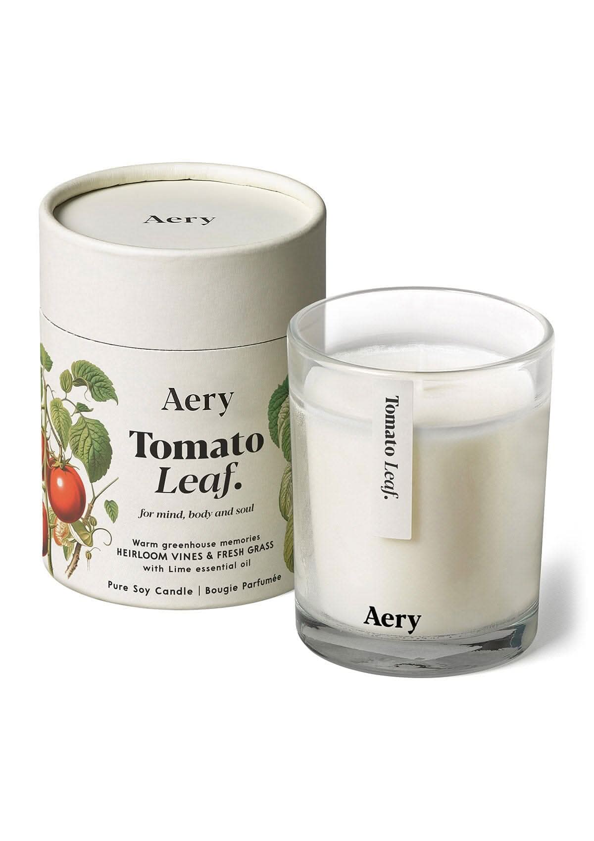 Tomato Leaf Cream candle displayed next to product packaging on white bacground