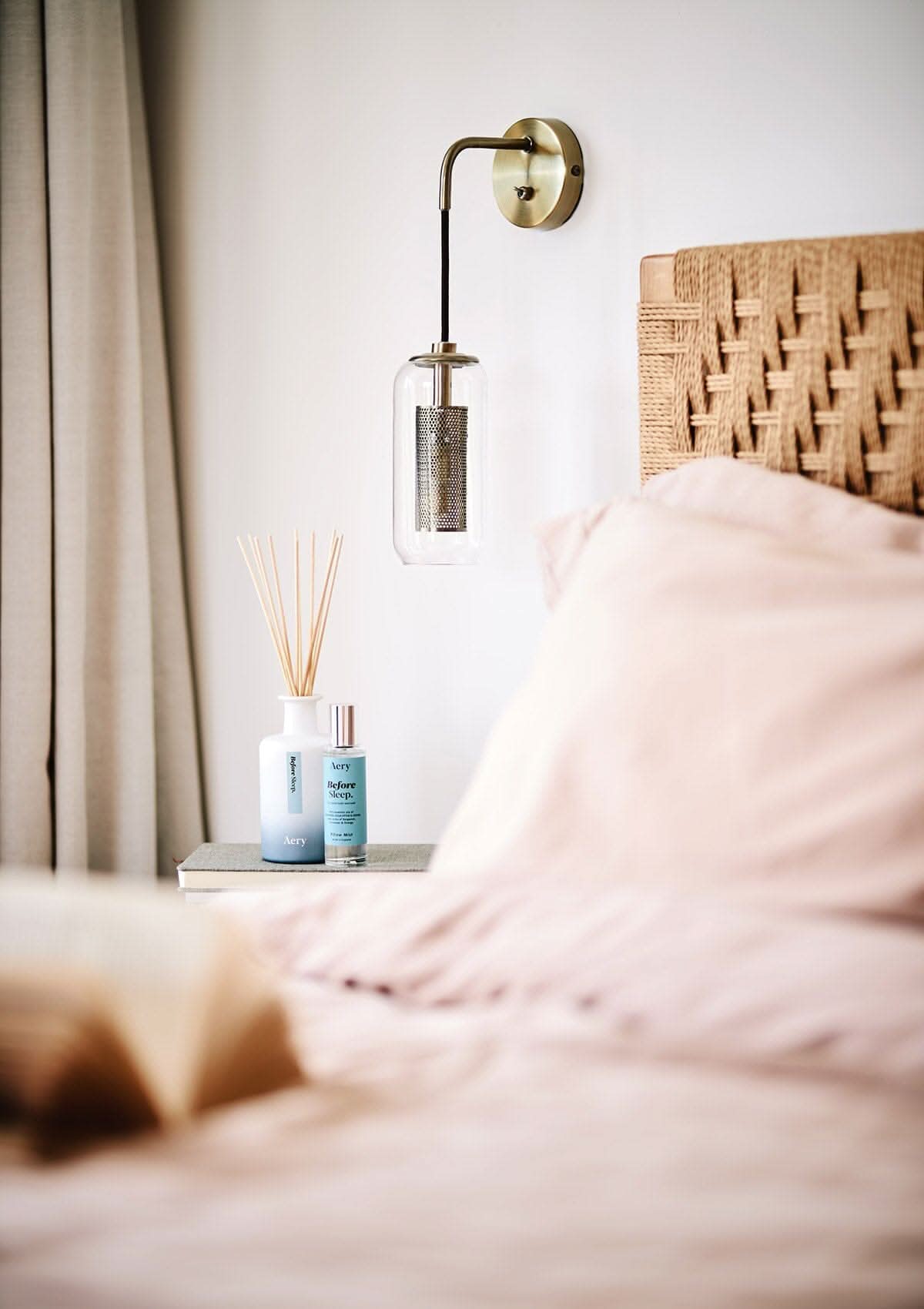 Blue Before Sleep Room Mist displayed next to diffuser placed on bedside table