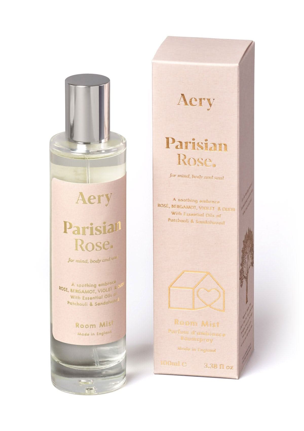 Pale pink Parisian Rose room mist displayed next to product packaging by Aery on white bacground
