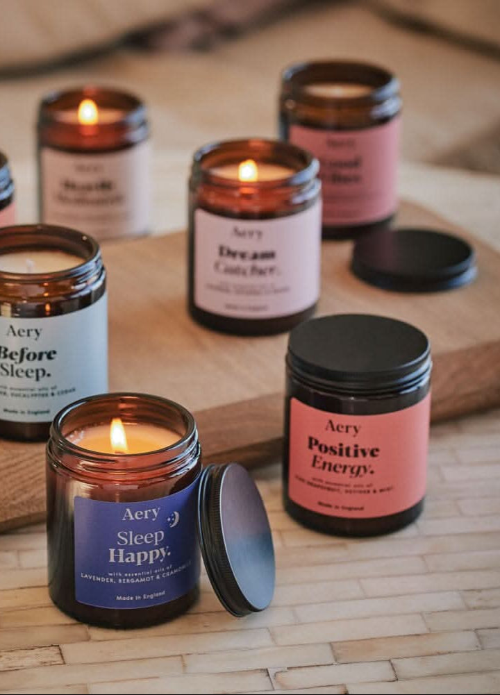 assortment of aery living aromatherapy jar candles in apothecary jars
