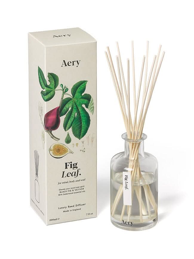 Cream Fig Leaf reed diffuser by aery displayed next product packaging on white bacground