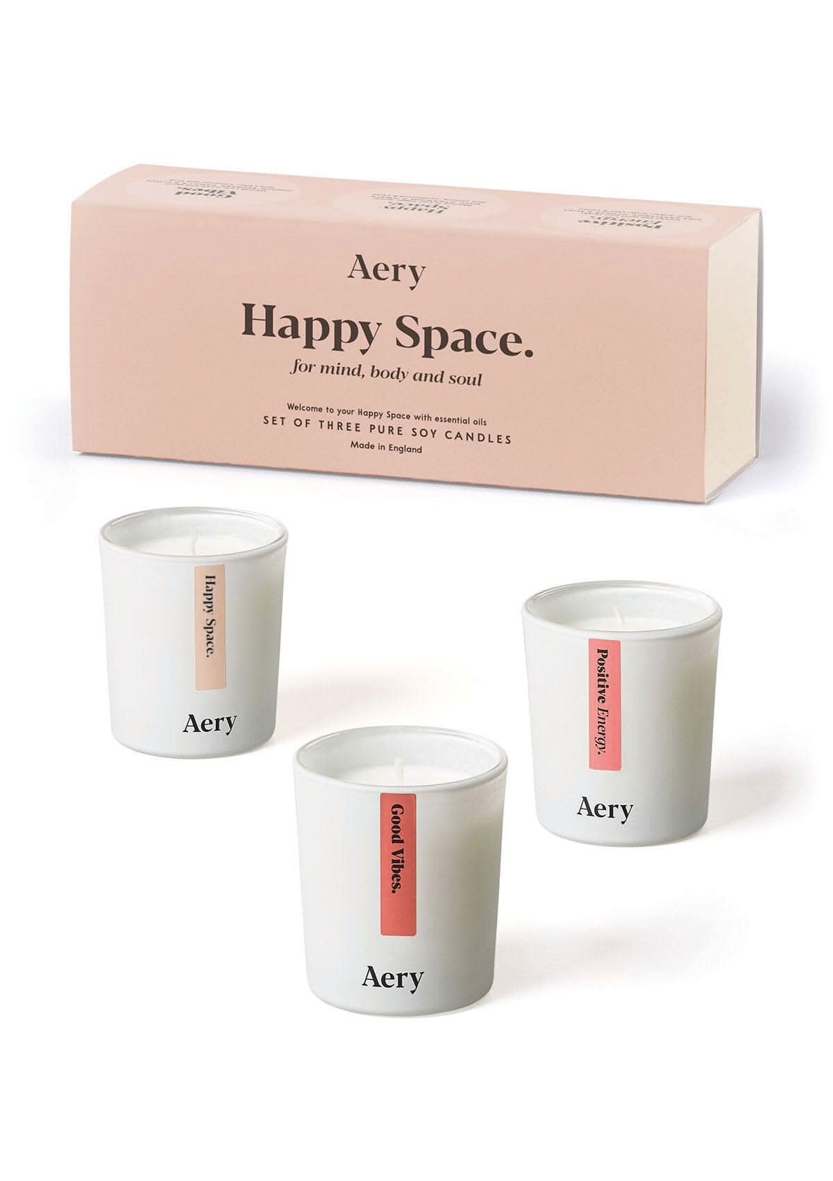 Pink Happy Space candle set of three by Aery displayed by product packaging on white bacground