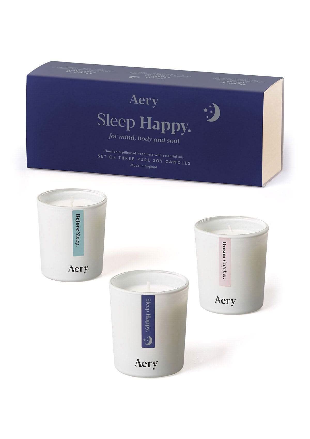 Blue Sleep Happy candle gift set of three by Aery displayed next to product packaging on white bacground