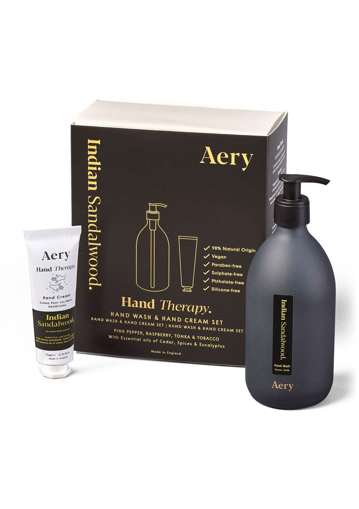Black Indian Sandalwood Hand wash and Cream displayed next to product packaging on white background