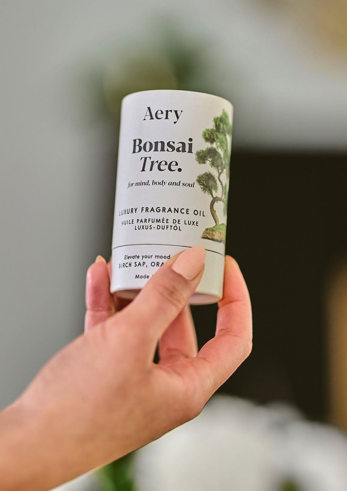 Bonsai Tree fragrance oil by Aery held in hand