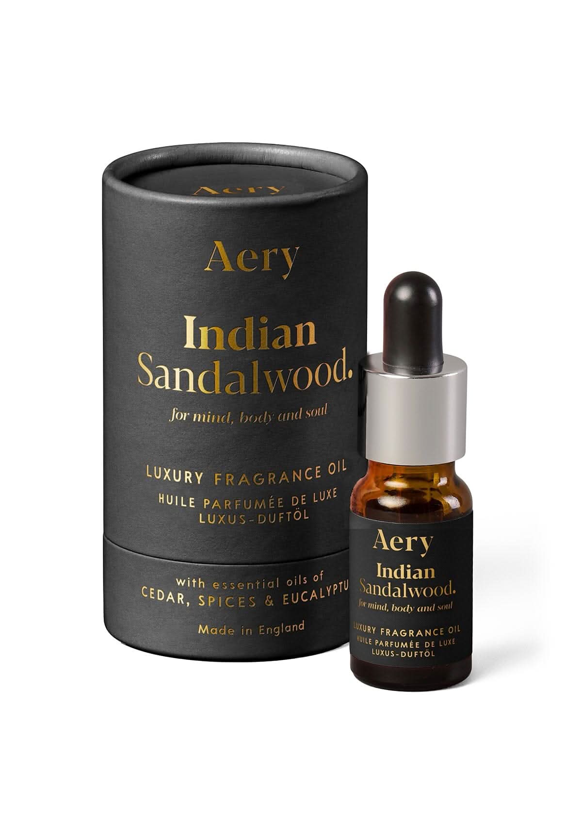 Black Indian Sandalwood fragrance oil displayed next to product packaging by Aery on white background