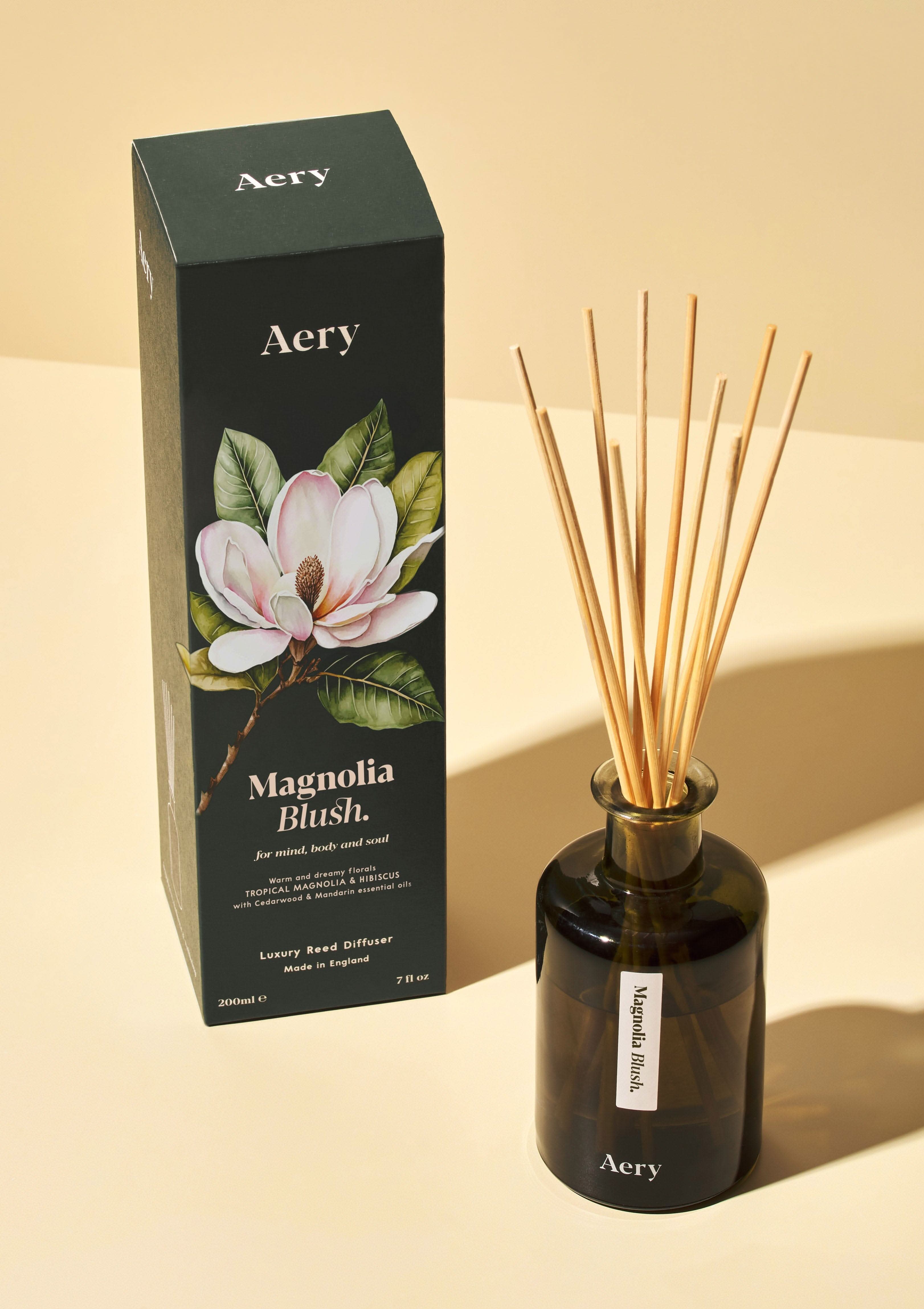 magnolia blush reed diffuser with decorative packaging on colour bacground