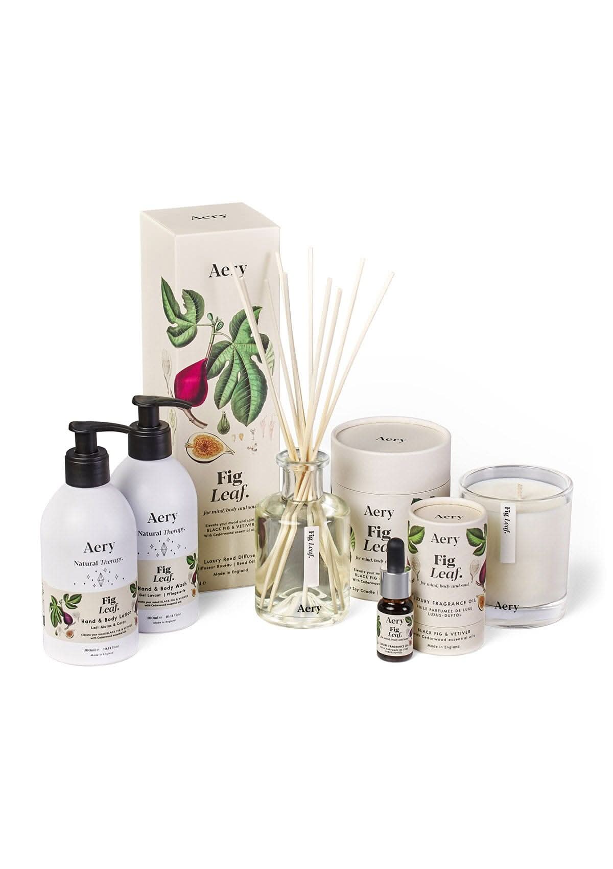 Cream Fig Leaf candle, diffuser, fragrance oil, hand and body wash and hand and body lotion by Aery displayed on white bacground