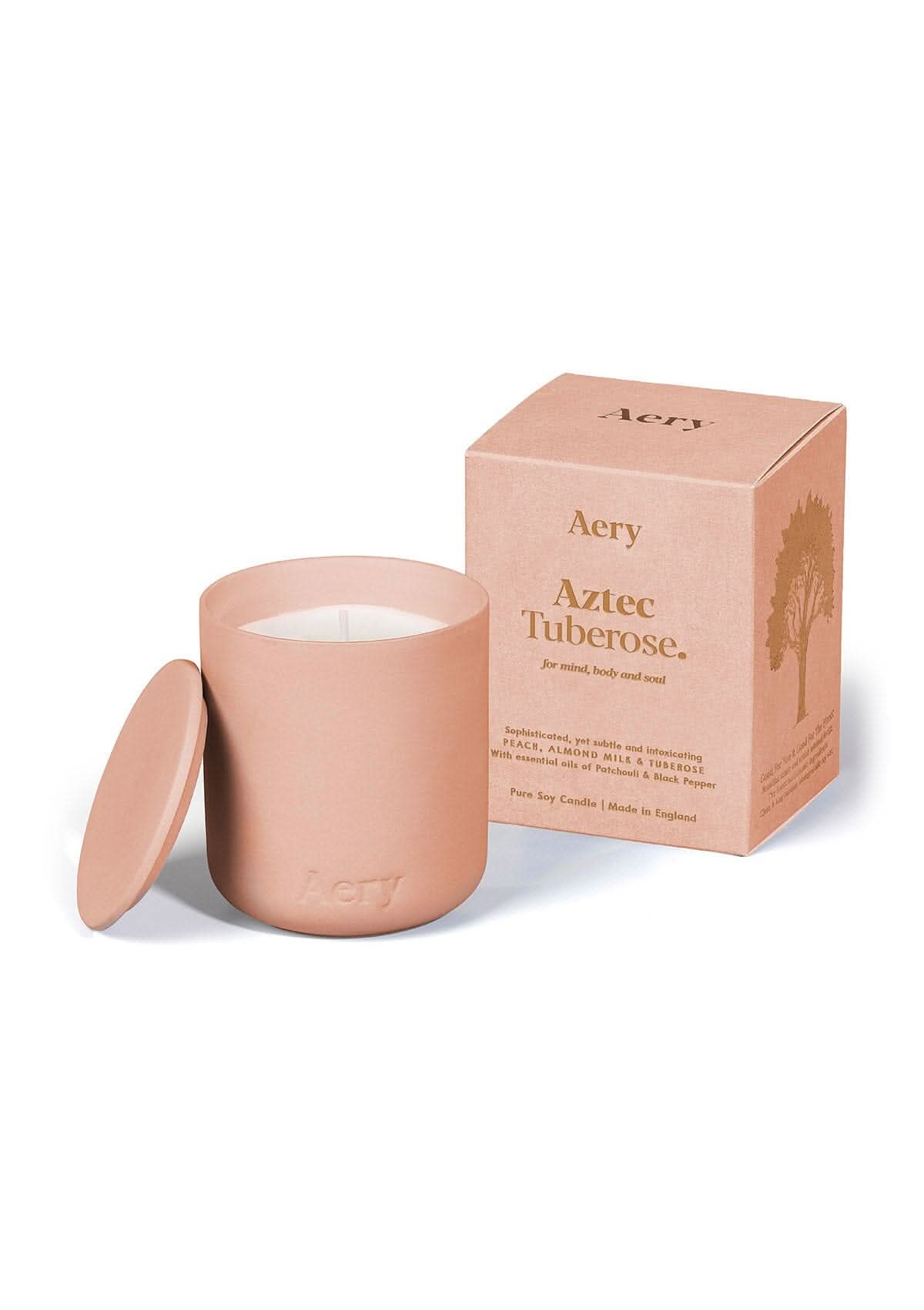 Peach Aztec Tuberose ceramic scented candle  by Aery on white bacground