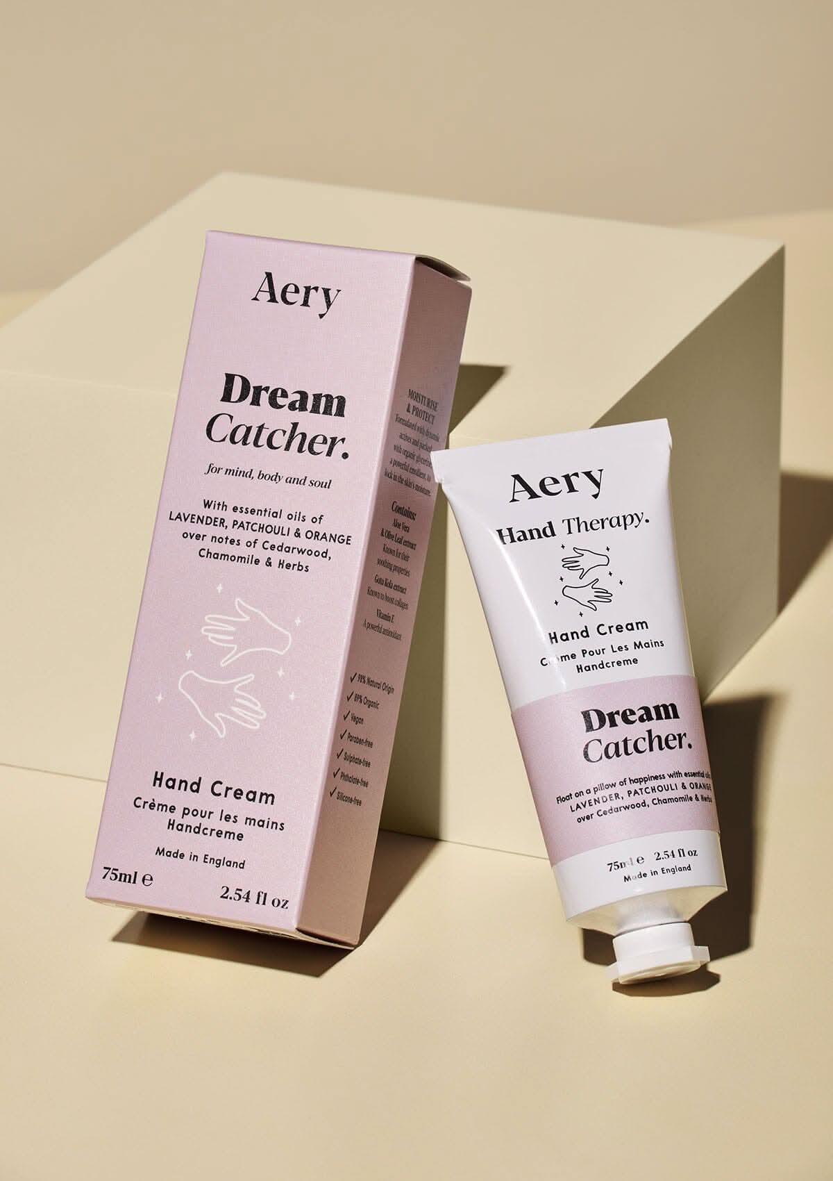 Lilac Dream Catcher hand cream displayed next to product packaging by Aery on cream background