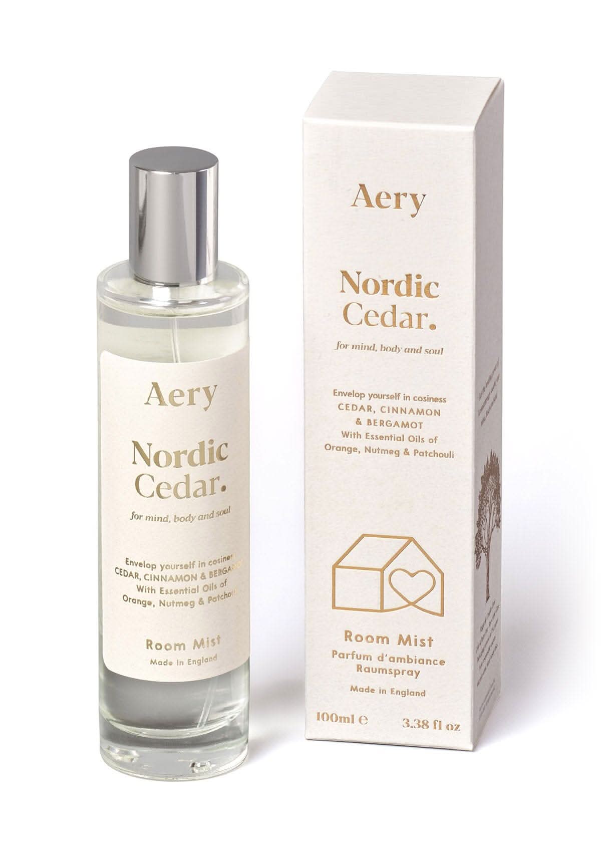 White Nordic Cedar room mist displayed next to product packaging by Aery on white bacground 